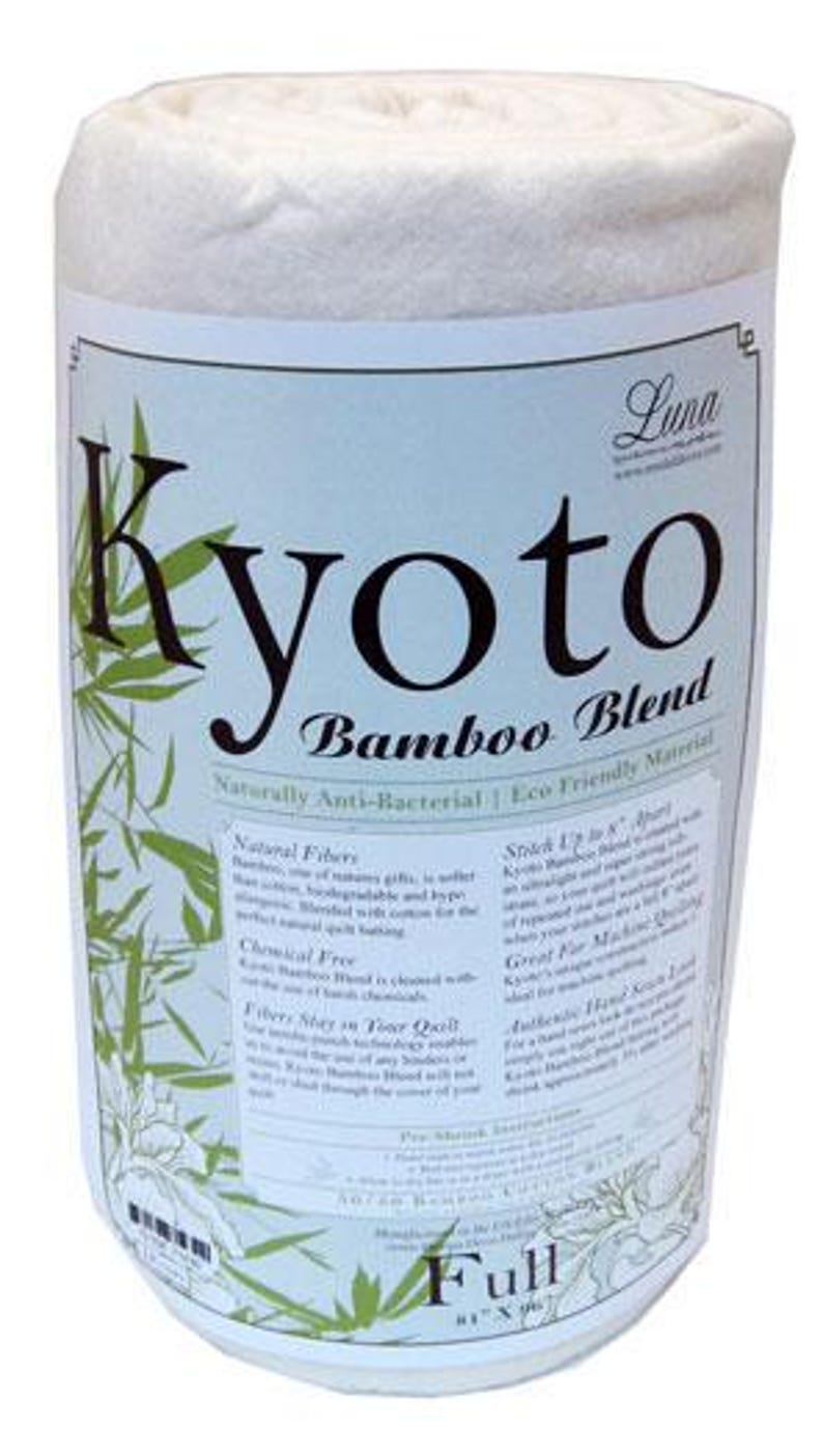 May include: A rolled white fabric with a label reading "Kyoto Bamboo Blend." The label has green bamboo leaf designs and text: "Naturally Anti-Bacterial | Eco Friendly Material." The product is a "Full" size, measuring 206cm x 244cm.