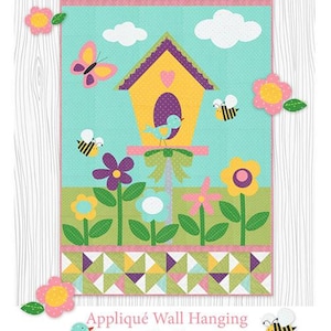 May include: A colorful appliqué wall hanging with a spring theme. The design features a yellow birdhouse, butterflies, bees, flowers, and the text "hello spring." The wall hanging measures 30 x 48 inches.