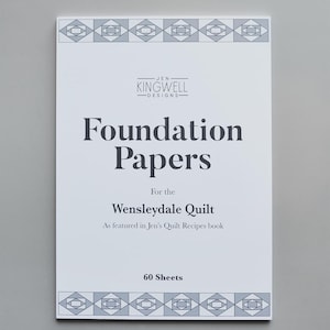 May include: A white booklet with the title "Foundation Papers" for the Wensleydale Quilt, featuring the Jen Kingwell Designs logo. The cover has geometric patterns and states "60 Sheets".