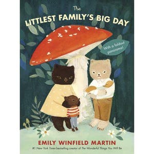 May include: A children's book cover featuring a whimsical illustration. The title reads "The Littlest Family's Big Day." The artwork depicts three animal characters under a large red mushroom. The author's name, Emily Winfield Martin, is also displayed.