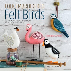 May include: A book titled "Folk Embroidered Felt Birds" with 20 modern folk art designs to make and embellish. The cover features a pink flamingo, a white swan, a blue and yellow bird, and a black and white puffin.