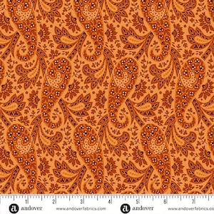 May include: Orange paisley fabric with a repeating pattern of teardrop-shaped motifs and floral elements in shades of brown and orange. The fabric has a detailed, vintage-inspired design, suitable for quilting or apparel.