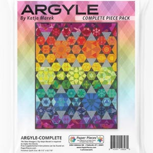 May include: A complete piece pack for the Argyle quilt pattern by Katja Marek. The quilt features a rainbow of colours and a geometric design. The finished quilt size is 48 1/2 inches by 62 7/8 inches.