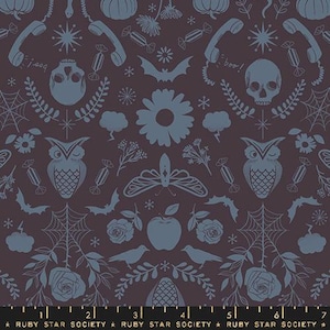 May include: A dark purple fabric with a repeating pattern of owls, butterflies, pumpkins, bats, apples, and other Halloween-themed imagery in a blue-grey color. The fabric has a ruler with the text "RUBY STAR SOCIETY" printed on it.