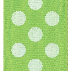 May include: Green fabric with a white polka dot pattern. The fabric has a subtle texture.