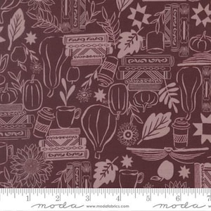 May include: Burgundy fabric featuring a white line drawing pattern of books, pumpkins, coffee cups, leaves, and flowers. A ruler is visible along the bottom edge.