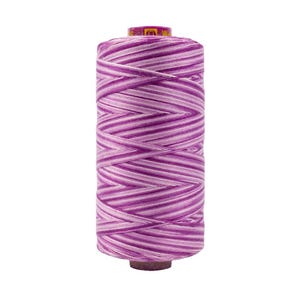 May include: A cylindrical spool of thread featuring a variegated pattern of alternating horizontal stripes in shades of deep purple, light lavender, and white. The top of the spool has a small yellow label with black text and a logo.