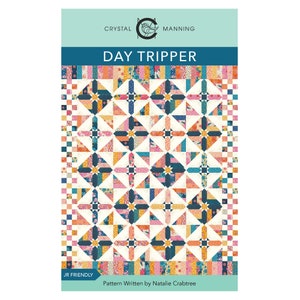 May include: A quilting pattern titled "Day Tripper" by Crystal Manning. The pattern features a colorful quilt design with a geometric pattern of squares, triangles, and stars. The pattern is JR Friendly and written by Natalie Crabtree.