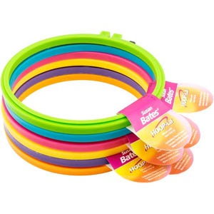 May include: Set of five colorful plastic embroidery hoops, ranging in size from small to large. The hoops are stacked on top of each other, with the largest hoop on the bottom and the smallest hoop on top. The hoops are all different colors, including green, blue, pink, yellow, and purple. The packaging includes the Susan Bates brand name and the product name "HOOP-La!"
