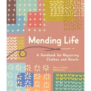 May include: A book cover with the title "Mending Life" and the subtitle "A Handbook for Repairing Clothes and Hearts." The cover features a pink background with colorful geometric patterns and the authors' names.