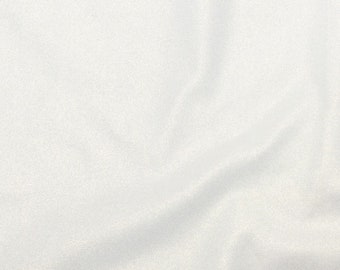 May include: A solid white fabric with a subtle, fine-grained texture and a soft, shimmering finish. The material is draped in gentle, flowing folds that create light and shadow across the surface, highlighting the smooth, consistent appearance.