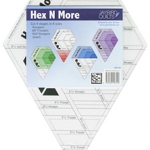 May include: A white plastic quilting ruler with a diamond shape. The ruler has markings for different sizes of hexagons, triangles, and jewels. The ruler is labeled "Hex N More" and includes the text "Cut 4 shapes in 4 sizes: Hexagons, 60° Triangles, Half Hexagons, Jewels".