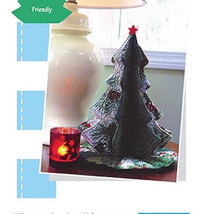 May include: A quilting pattern for a tabletop Christmas tree, called "Tabletop Tannenbaum". The pattern is designed by Kristine Poor and is part of the Poorhouse Quilt Designs collection. The pattern is for an advanced beginner and the finished tree is 13 inches tall with a 12 inch diameter skirt.