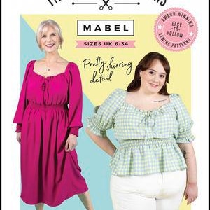 May include: Tilly and the Buttons Mabel sewing pattern for improvers, sizes UK 6-34. The cover features a magenta midi dress and a light green and white gingham top, both with shirring detail, square necklines, and tie-front closures.