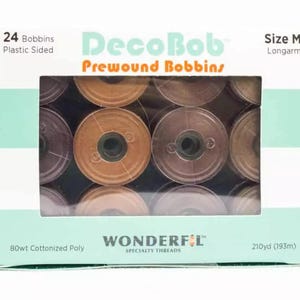 May include: A box of 24 DecoBob prewound bobbins for sewing machines. The bobbins are size M longarm and are made of 80wt cottonized polyester thread. The bobbins are brown and beige in color.