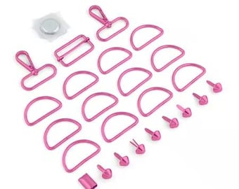 May include: A collection of pink metal hardware components for crafting, including D-rings, rivets, clasps, and a magnetic snap. The items are arranged on a white surface, ideal for bag making or other DIY projects.