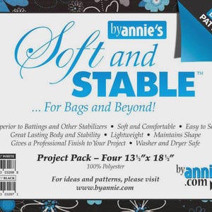 May include: A white project pack with the text "Soft and Stable" in blue script and block letters. The pack includes four 13.5" x 18.5" pieces of 100% polyester material, ideal for bag making and other projects. Includes a bonus pattern.