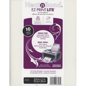 May include: A package of 10 sheets of HeatnBond EZ-Print Lite iron-on adhesive. The package is white with purple and black text and graphics. The text on the package reads "HeatnBond EZ-Print Lite iron-on adhesive, adhesive de activación con plancha, 10 sheets, hojas, Great for: Lightweight Fabrics, Machine Appliqués, Quilting, Ideal Para: Telos Ligeros, Aplicaciones con Máquina Acolchados, Pre-Cut Sheets, Precortado Hojas, Permanent, Permanente, No Steam Required, Machine Washable, No Requiere Vapor, Lavable en Máquina, 8.5 in x 11 in, 22 cm x 28 cm".