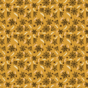 May include: A seamless pattern featuring black spiderwebs on a mustard yellow background. The pattern also includes small black spiders and white and pink floral elements.
