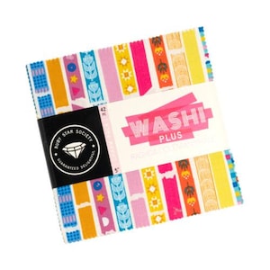 May include: A stack of colorful washi tape rolls with various patterns, including floral and geometric designs. The packaging features the text "Washi Plus" and "Ruby Star Society". Each roll is 5 inches in length.