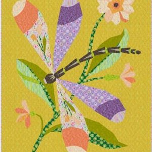May include: A colourful, abstract quilt featuring a dragonfly and flowers. The dragonfly has purple, orange, and white patterned wings. The flowers are peach and white, with green stems and leaves, set against a yellow background.