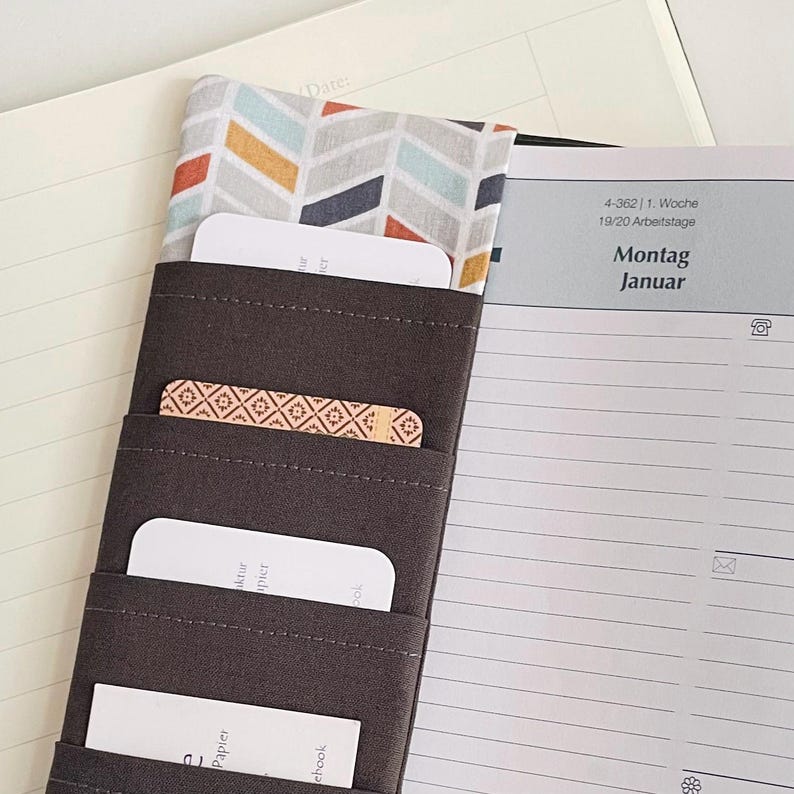 Square calendar cover for 2027 A5 calendars, organizer book cover, Scandinavian style, grey, red, blue, geometric, everyday helper, organizational talent image 3
