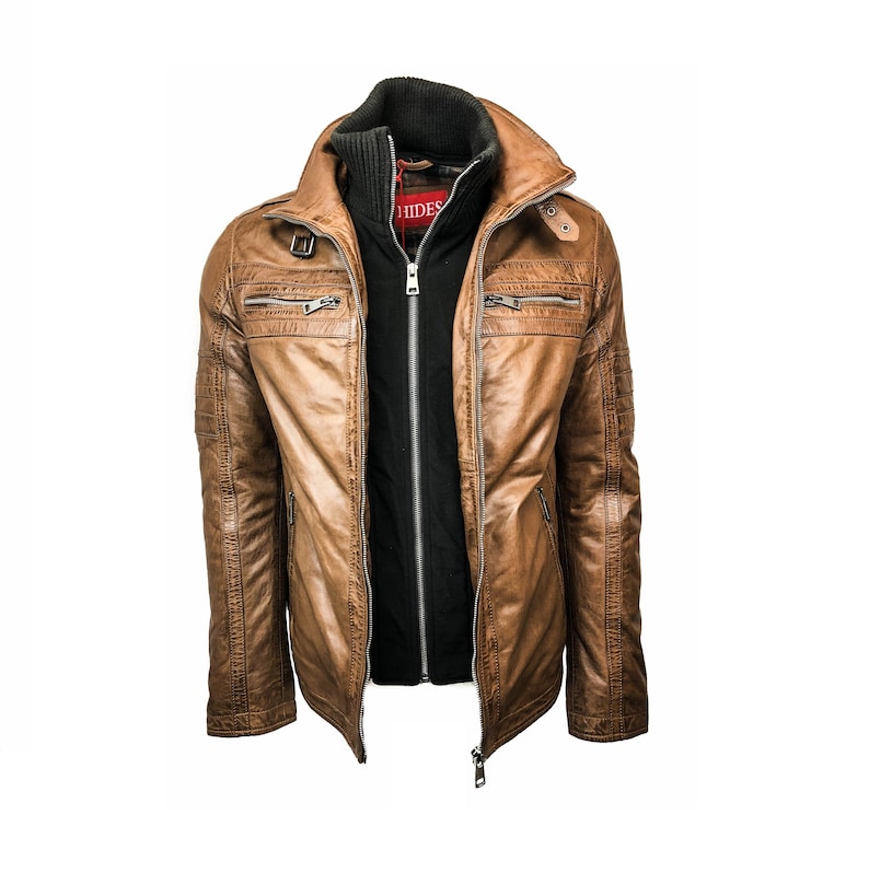 May include: A brown leather jacket with a black inner lining and a zipper closure. The jacket has a high collar and multiple pockets.