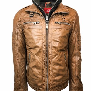 May include: A brown leather jacket with a zipper closure and multiple pockets. The jacket has a high collar with a black and green lining. The label on the jacket reads "HIDE".