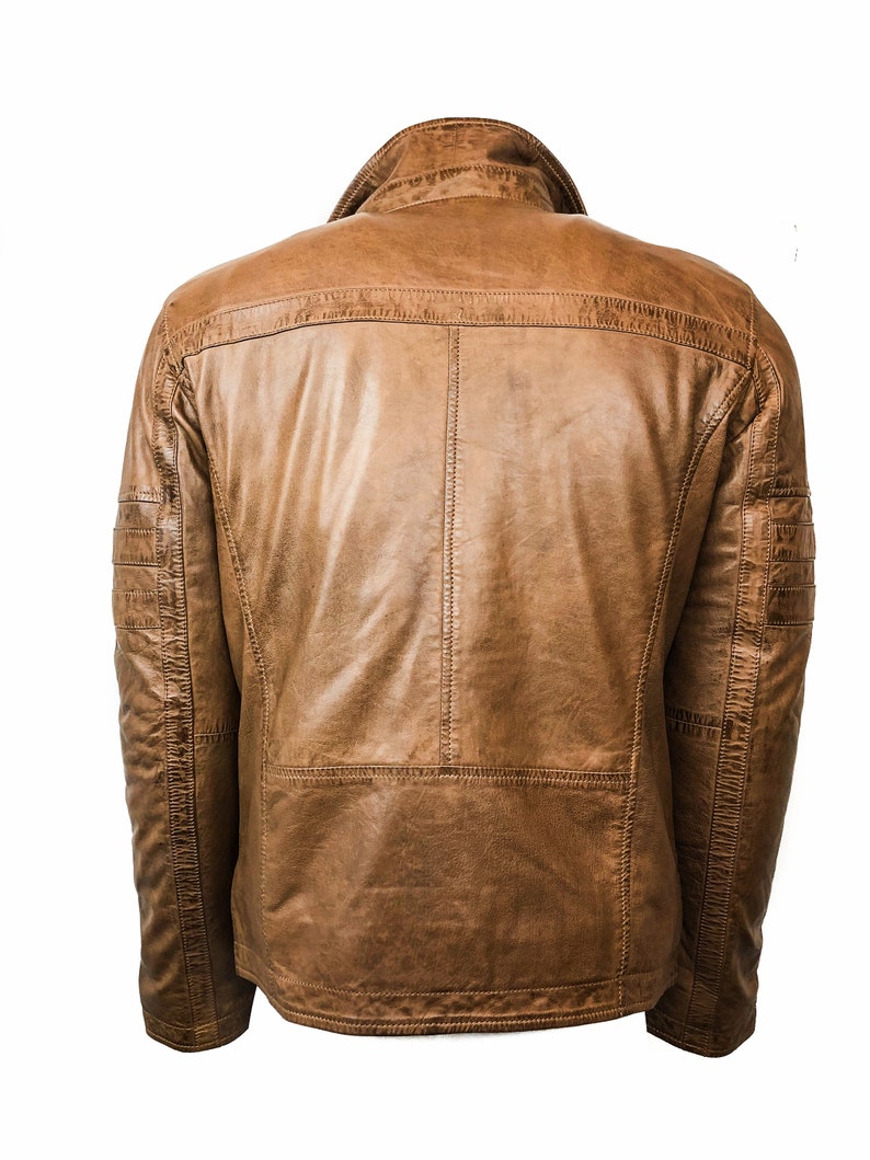 May include: A brown leather jacket with a zipper closure and a stand-up collar.
