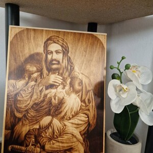 Imam Ali and orphans wood  burn  pyrography   size  A4   image  burned  on ply   wood