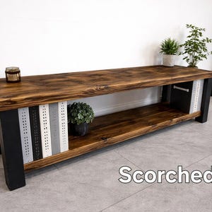 May include: A white-painted wooden sign, distressed for effect, bearing the handwritten text "Welcome to our home" in black. Suitable for indoor or outdoor display, it's a welcoming home decor item.
