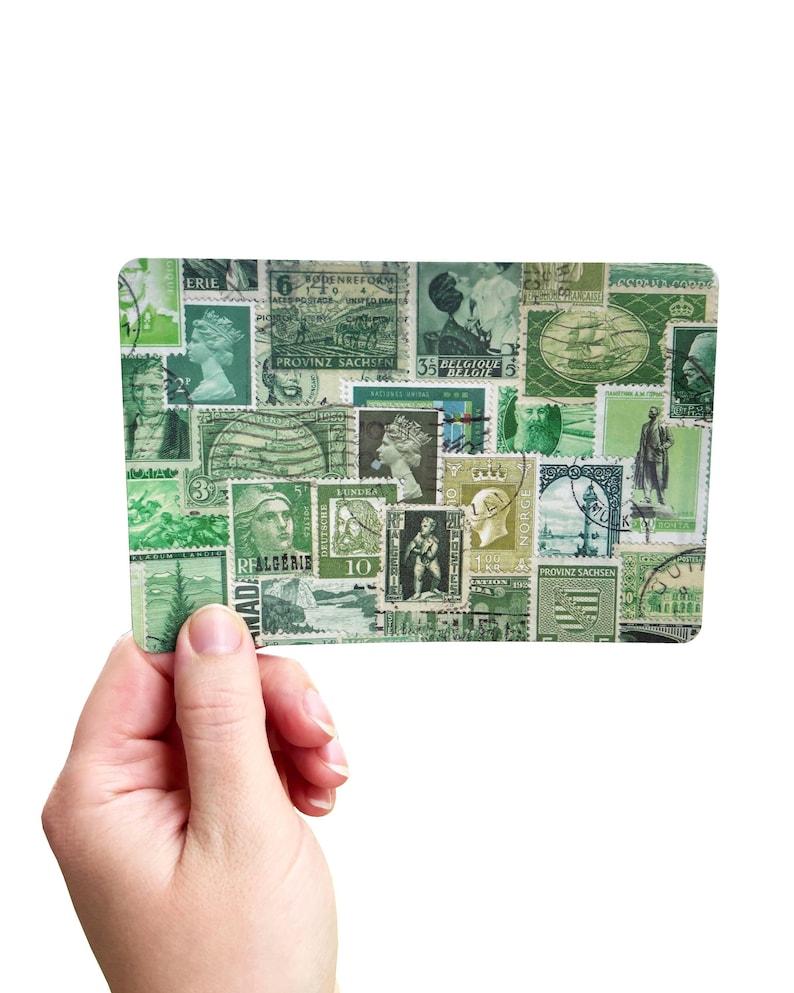 May include: A rectangular card filled with green postage stamps, held in a hand. The stamps depict portraits, ships, and other designs. The card has rounded edges. The background is white.