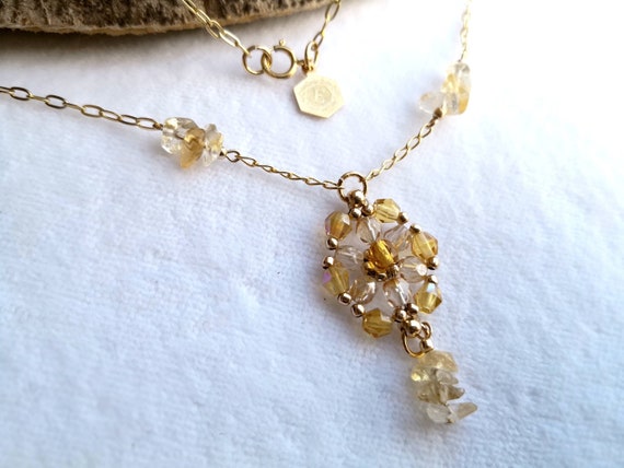 18-Inch Rhodium Plated Necklace with 4mm Light Sapphire Birthstone Beads and Sterling Silver Saint Juan Diego Charm.