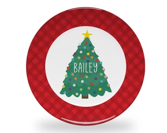May include: Red and white Christmas plate with a green Christmas tree with colorful ornaments and the name Bailey on it.