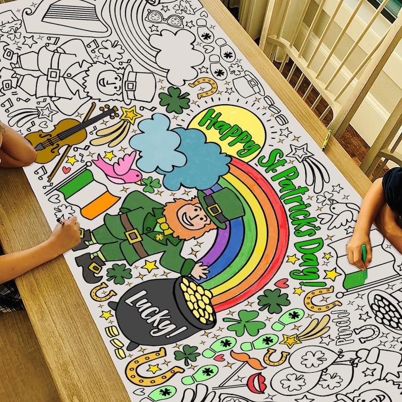 May include: A large white paper tablecloth with a St. Patrick's Day theme. It features a rainbow, a leprechaun, a pot of gold, shamrocks, and the text "Happy St. Patrick's Day!"