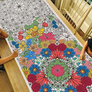 May include: A large coloring page featuring a detailed floral design with a variety of flowers in shades of red, pink, blue, yellow, and green. The flowers are arranged in a circular pattern, creating a beautiful and intricate design.