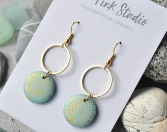 Turquoise and gold wooden earrings with elegant gold speckle design