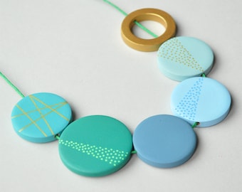 Green flat bead necklace in minimal design in pastel colours