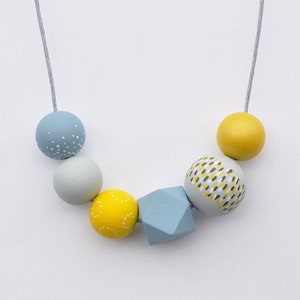 Yellow bead necklace hand painted in coastal greys and yellows.