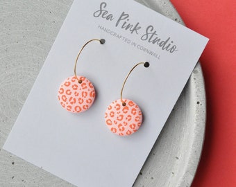 Pink and orange leopard print hoop earrings - colourful statement earrings made with hand painted wooden beads.