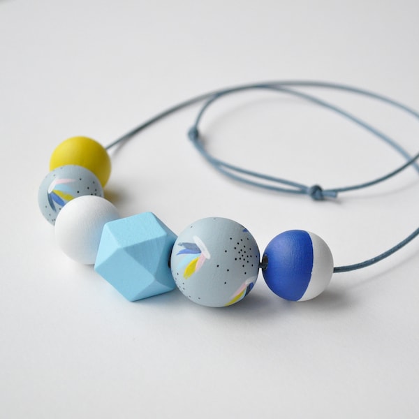 Wooden bead necklace with multi-coloured beads, hand painted in a yellow & blue coastal inspired colour palette