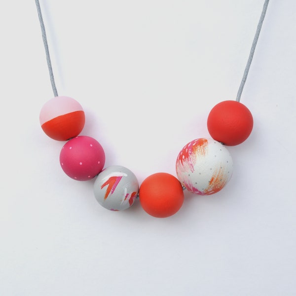 Pink and orange necklace, wooden beads with an abstract floral theme