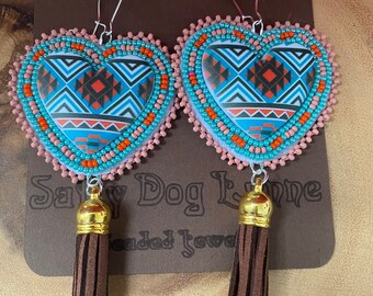 Indigenous designs heart earrings. Leather tassels