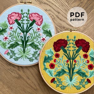 May include: Two floral embroidery hoops. One features pink flowers on a light blue background, the other has red flowers on a yellow background. Both have green leaves and are in wooden hoops. The text "PDF pattern" is visible.