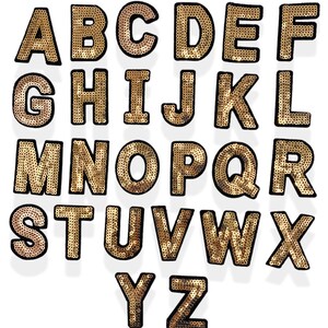 Peut inclure: Lettres de l'alphabet dorées avec des contours noirs, faites de paillettes. Chaque lettre est découpée individuellement et peut être utilisée pour l'artisanat, la couture ou la décoration.