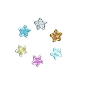 May include: Six embroidered star-shaped patches in various colors, including silver, blue, gold, light blue, pink, and yellow. The stars are all outlined in white.