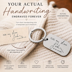 May include: A silver-coloured metal keyring tag featuring a custom engraving of the handwritten text 'all my Love. John' followed by a row of x's. The rectangular tag has rounded corners and is attached to a circular metal split ring for keys.