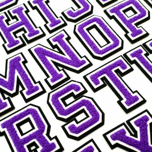 May include: Purple felt letters with a white outline and black backing. The letters are in uppercase and include the letters H, I, J, M, N, O, P, R, S, T, and X.