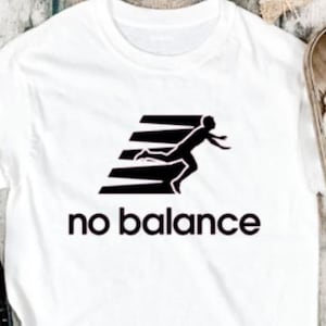 May include: White t-shirt with a black graphic of a person running and the text "no balance".
