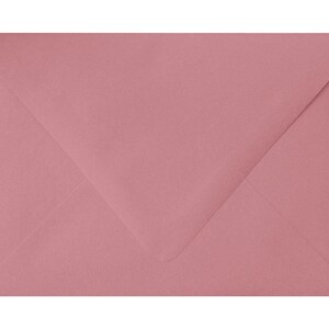 May include: A light pink envelope.